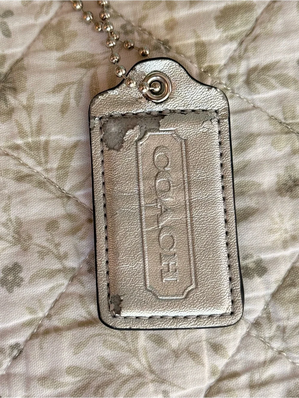 Coach silver metallic hang tag